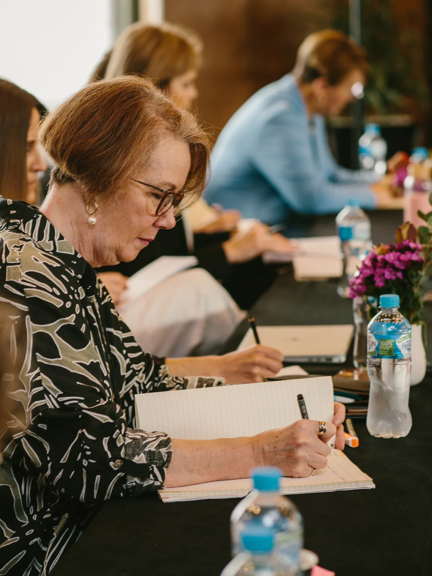 Women business owners in a leadership session